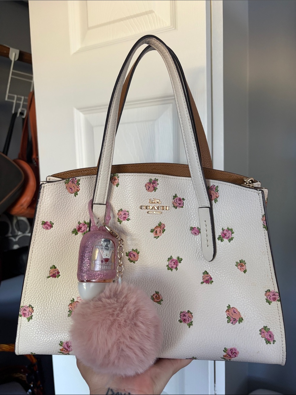 Coach White Floral Leather Tote with Pink Pom Pom Charm